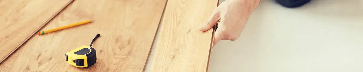 A professional installing wood flooring in Spokane, WA