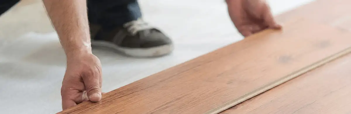 A professional installing laminate flooring in Spokane, WA